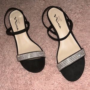 Low black heels with rhinestone strap across toes